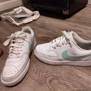 Green and white Nikes